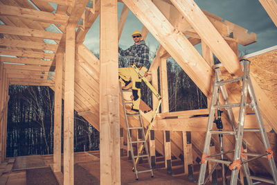 Portrait of man standing at construction site