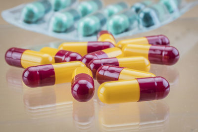 Close-up of multi colored bottles on table