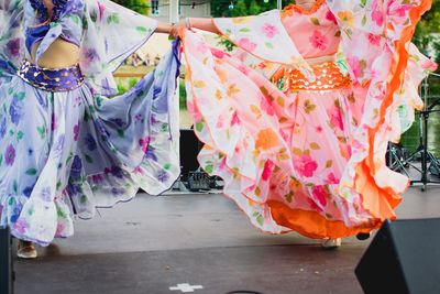 Close-up of multi colored umbrellas hanging on street