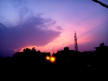 Low angle view of silhouette trees against sky at sunset