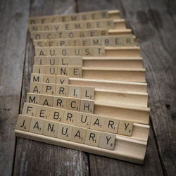 High angle view of alphabets on wooden table