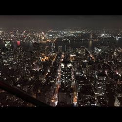 Aerial view of city lit up at night