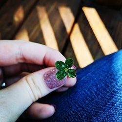 Close-up of hand holding salad