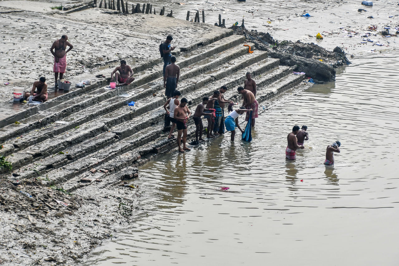 HIGH ANGLE VIEW OF GROUP OF PEOPLE ON BEACH