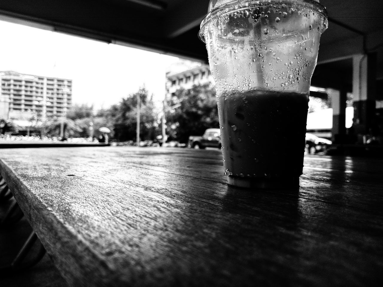 CLOSE-UP OF GLASS OF JUICE ON TABLE