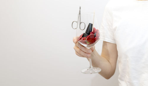St valentine's day concept for manicure, pedicure service, spa salon. beautician holds wine glass