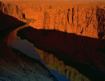 Scenic view of river at sunset