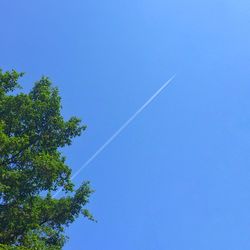 Low angle view of vapor trail in sky