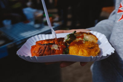 Close-up of man holding food