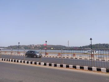View of road against clear blue sky