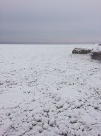 Scenic view of sea against sky during winter