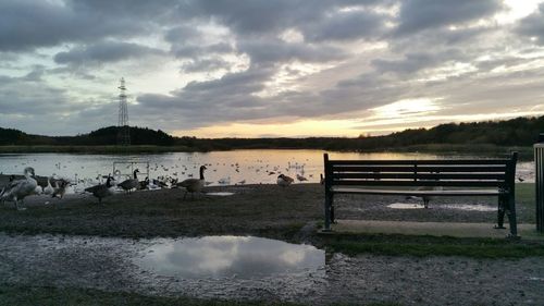 Scenic view of lake against cloudy sky