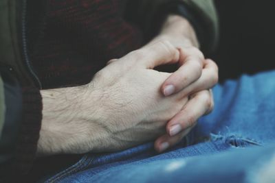 Close-up of man hand on finger