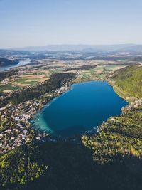 High angle view of lake and trees against sky