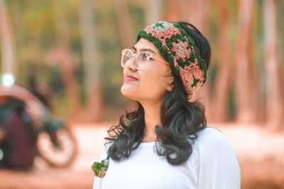 Portrait of young woman wearing sunglasses