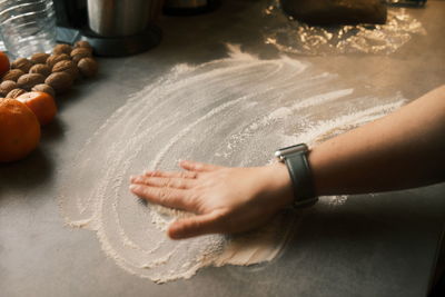 Cropped hand of person preparing food