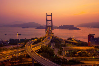 High angle view of bridge over sea during sunset