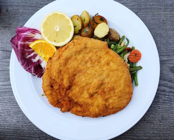 High angle view of fruits in plate on table