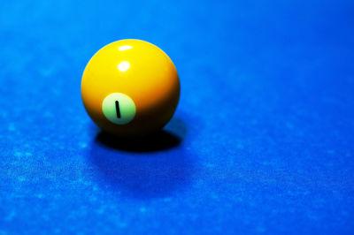 High angle view of yellow pool ball on table