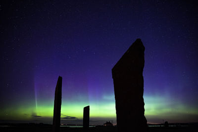 Northern lights with stones of stenness, orkney islands, uk.