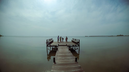 Pier over sea against sky