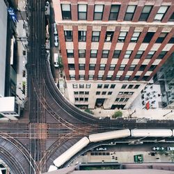 High angle view of railroad tracks amidst buildings