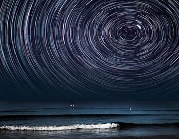 Scenic view of sea against sky at night