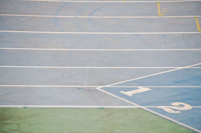 High angle view of running track with numbers in stadium
