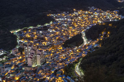 High angle view of illuminated buildings at night