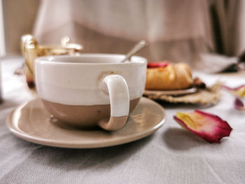 Close-up of coffee cup on table