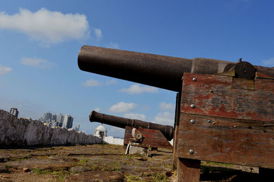 Old rusty metallic structure against sky