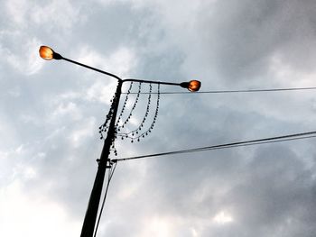 Low angle view of street light against sky