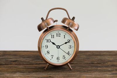 Close-up of clock against white background