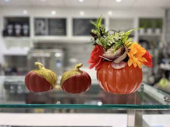 Close-up of red berries on glass window