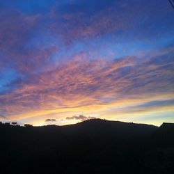 Scenic view of mountains at sunset