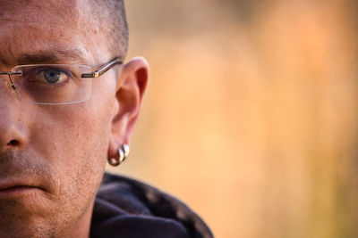 Close-up portrait of man wearing eyeglasses