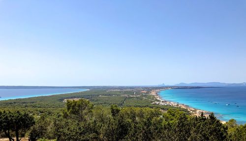 Scenic view of sea against clear blue sky