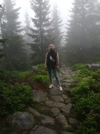 Full length portrait of senior woman on land