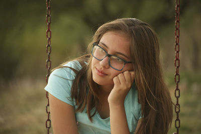 Thoughtful girl in park