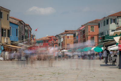 Group of people on city street during rainy season