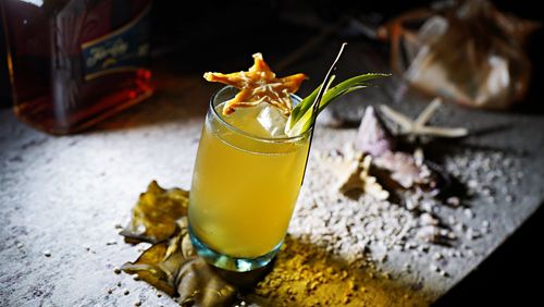 Beach with starfish and a star fruit cocktail