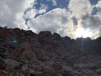 Low angle view of rock formation against sky