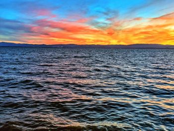 Scenic view of sea against sky during sunset