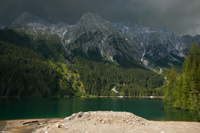 Scenic view of lake and mountains against sky