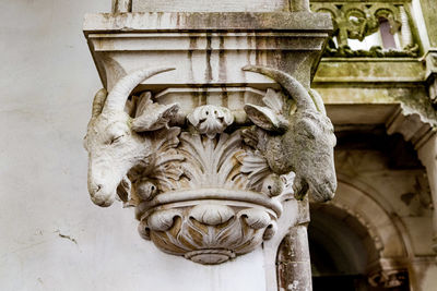 Low angle view of statue against building