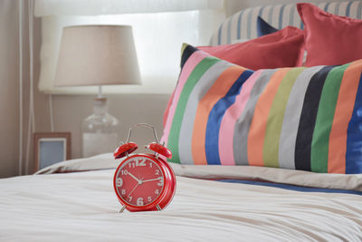 Red roses on bed at home