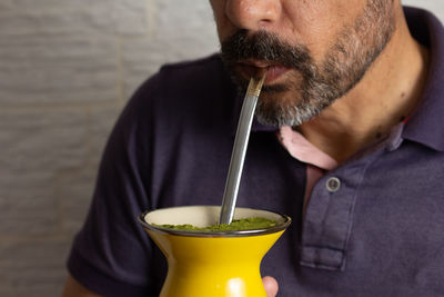 Midsection of man holding ice cream