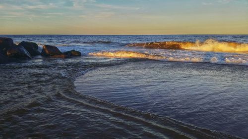 Scenic view of sea at sunset