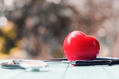 Close-up of red heart shape on table