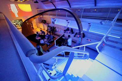 High angle view of people sitting on staircase